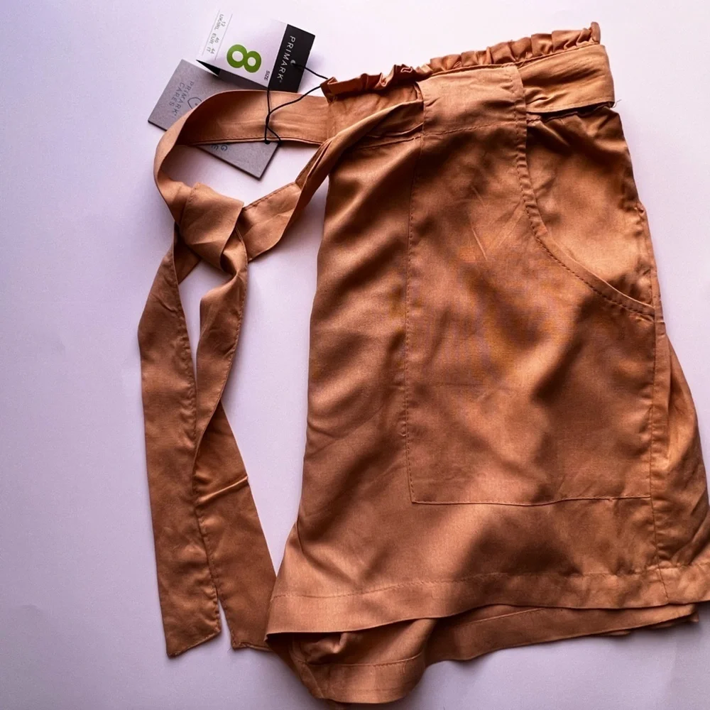 Dress shorts, yellow size 8 . PRIMARK CARES